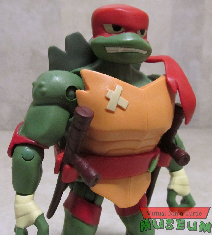 Raphael holding tonfas