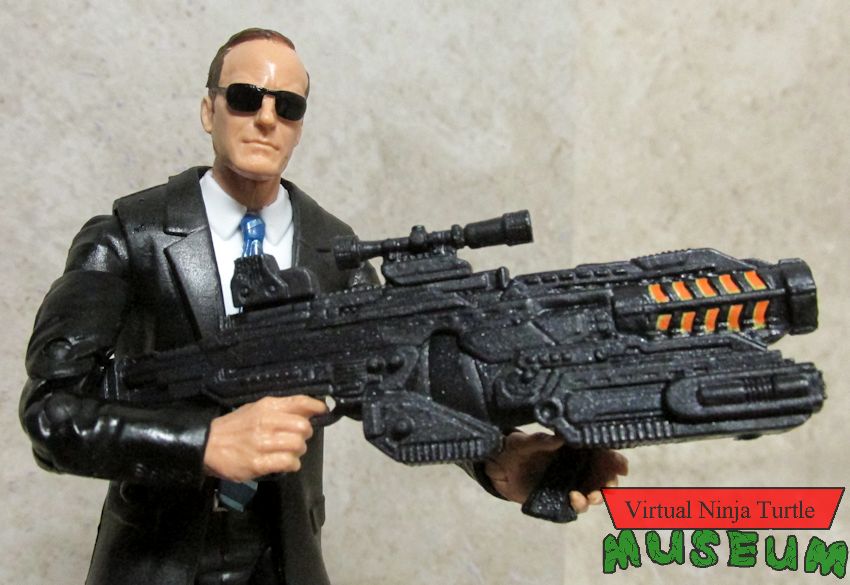 Agent Coulson with gun and shades