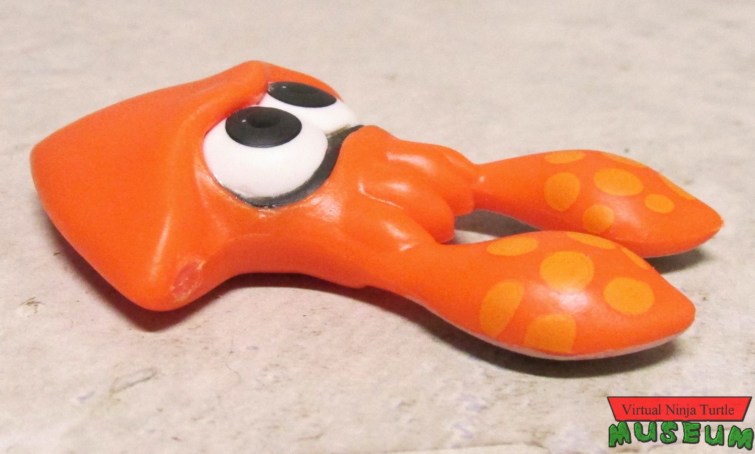 Orange Squid on ground