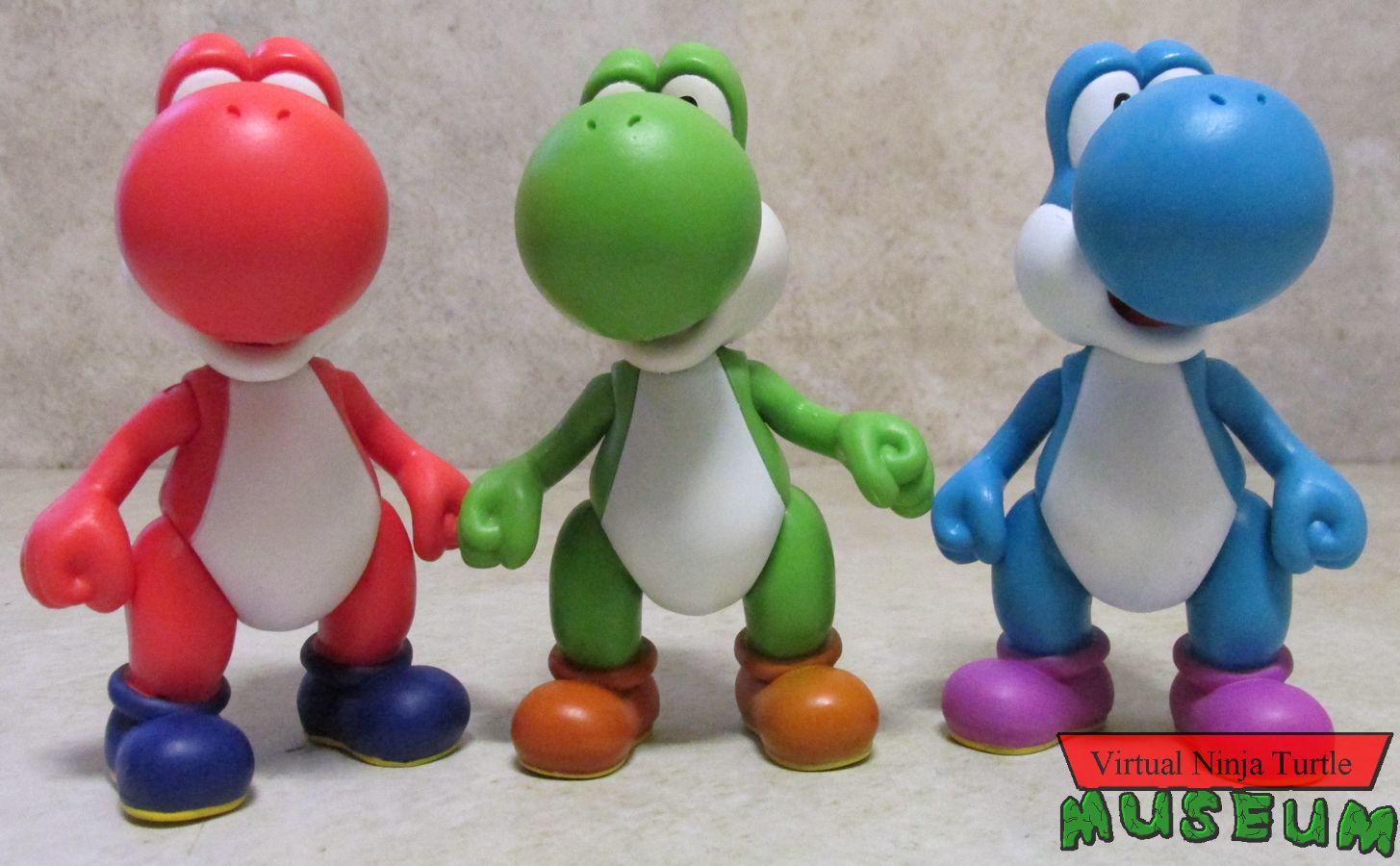 blue, green and red Yoshis
