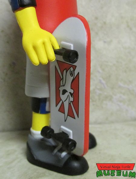 Tony Hawk holding skateboard